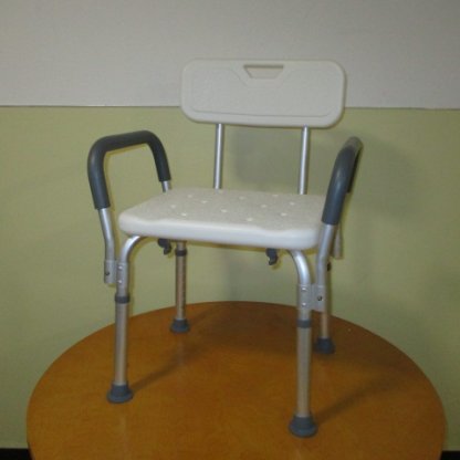 Shower chair with backrest and arms