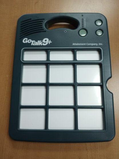 Dark green AAC device with nine big buttons and three smaller buttons up top