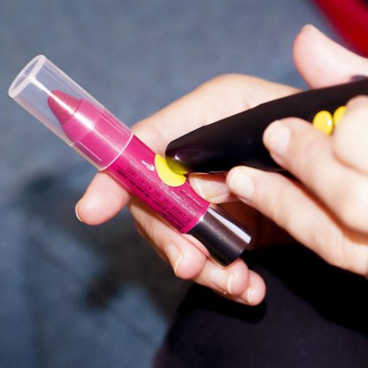 using a PenFriend to read a yellow label on pink lipstick