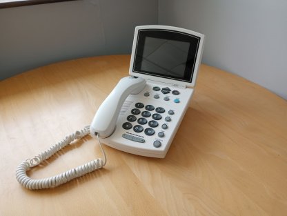 white big button caption phone