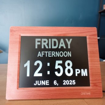 photo of calendar--wood frame, black background, white text