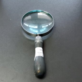 grey-handled magnifying glass