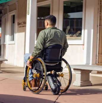 Adult Person facing away with SmartDrive attached to wheelchair