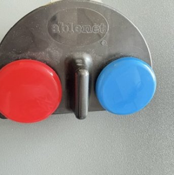 Black background with red button switch on right and blue button switch on left